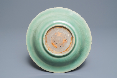 A Chinese Longquan celadon dish with underglaze peony design, Ming