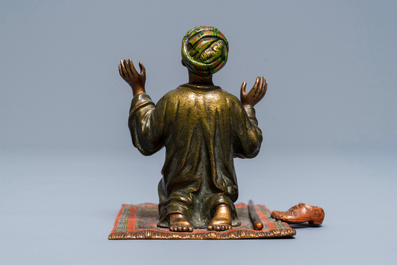 A cold-painted bronze group of a praying muslim, Vienna, signed Bergman, late 19th C.