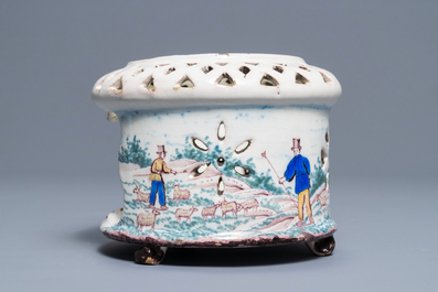 A polychrome Dutch Delft stove with a pastoral scene, late 18th C.