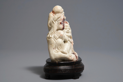 A Chinese Shoushan soapstone 'immortals' group, 19th C.