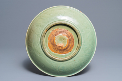A Chinese Longquan celadon charger with incised design, Ming