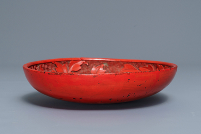 A Chinese cinnabar lacquer dish with floral design, 18/19th C.