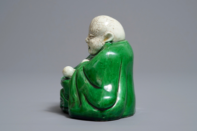 A Chinese verte biscuit model of Buddha with a child, Kangxi
