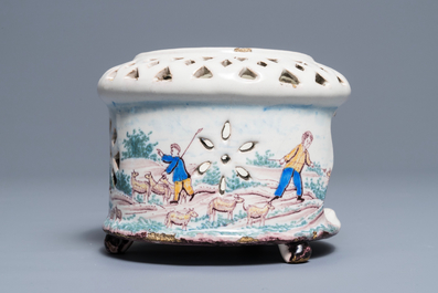 A polychrome Dutch Delft stove with a pastoral scene, late 18th C.