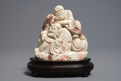 A Chinese Shoushan soapstone 'immortals' group, 19th C.