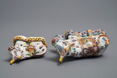 Two polychrome Dutch Delft models of recumbent cows, 18th C.