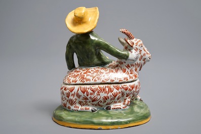 A polychrome Dutch Delft-style butter tub and cover in the shape of a buckrider, prob. D&egrave;svres, France, ca. 1900