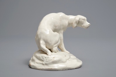 A white Dutch Delft model of a dog, 18th C.