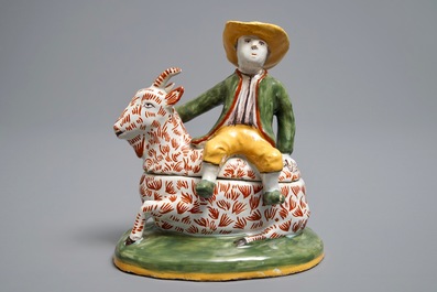 A polychrome Dutch Delft-style butter tub and cover in the shape of a buckrider, prob. D&egrave;svres, France, ca. 1900
