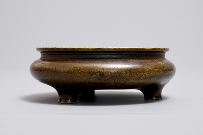 A Chinese bronze tripod censer, Xuande mark, Ming