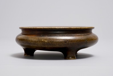 A Chinese bronze tripod censer, Xuande mark, Ming