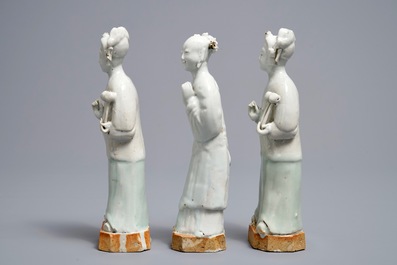 Three Chinese white- and celadon glazed biscuit figures, Qianlong