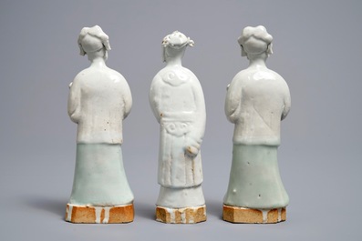 Three Chinese white- and celadon glazed biscuit figures, Qianlong