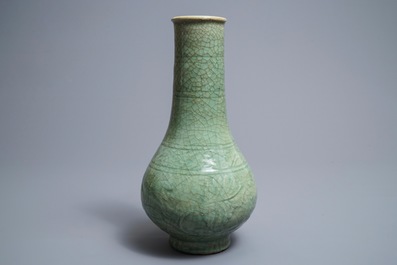 A Chinese Zhejiang celadon-green vase with underglaze design, Ming