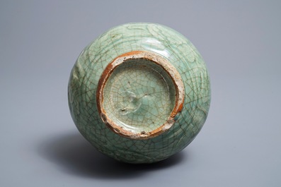 A Chinese Zhejiang celadon-green vase with underglaze design, Ming