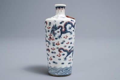 A Chinese blue, white and underglaze red 'dragon' vase, Kangxi mark, 19/20th C.