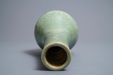 A Chinese Zhejiang celadon-green vase with underglaze design, Ming