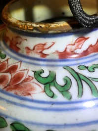 A pair of Chinese wucai jars and covers with floral design, Transitional period