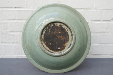 A Chinese Longquan celadon dish with underglaze design of peonies, Ming