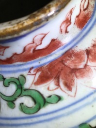 A pair of Chinese wucai jars and covers with floral design, Transitional period