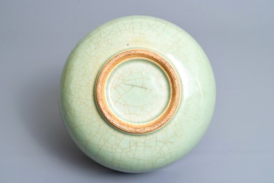 A Chinese celadon bowl on wooden stand, Kangxi/Yongzheng