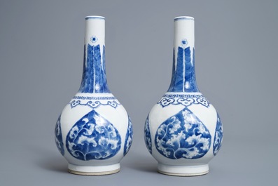 A pair of Chinese blue and white bottle vases, Kangxi mark, 19/20th C.