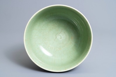 A Chinese celadon bowl on wooden stand, Kangxi/Yongzheng
