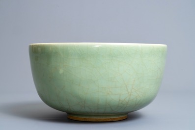 A Chinese celadon bowl on wooden stand, Kangxi/Yongzheng
