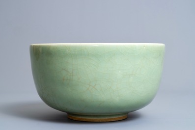 A Chinese celadon bowl on wooden stand, Kangxi/Yongzheng