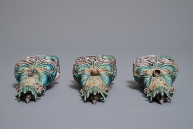 Three Chinese enamel on biscuit figures of Buddha, 19th C.