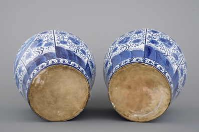 An impressive pair of blue and white Brussels faience covered vases, signed and dated 1861