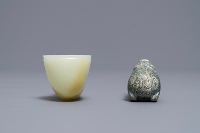 A Chinese jade deer rhyton cup and a spinach green jade pig, Han or later