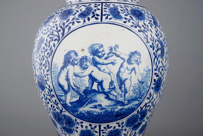 Une paire de grands vases couverts en fa&iuml;ence de Bruxelles en bleu et blanc, sign&eacute;s et dat&eacute;s 1861