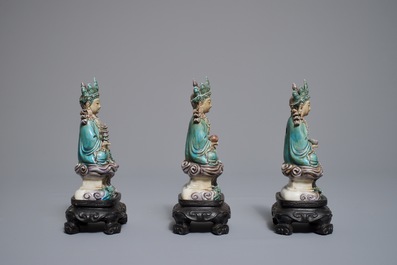 Three Chinese enamel on biscuit figures of Buddha, 19th C.