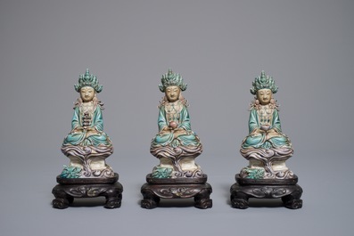 Three Chinese enamel on biscuit figures of Buddha, 19th C.