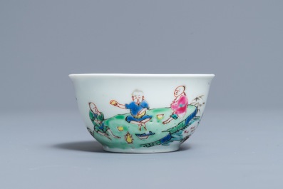 A fine Chinese famille rose cup and saucer with a river scene, Yongzheng