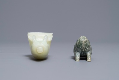 A Chinese jade deer rhyton cup and a spinach green jade pig, Han or later