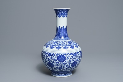 A Chinese blue and white Ming style bottle vase, Qianlong mark, 19/20th C.