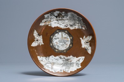 A Chinese capucin-ground grisaille and gilt cup and saucer, Qianlong