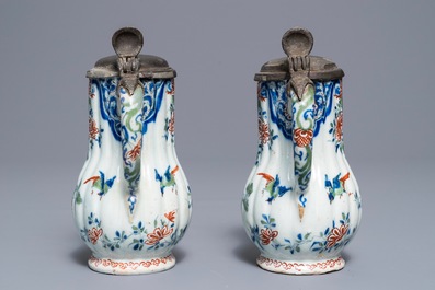 A pair of Dutch Delft cashmere palette jugs with pewter covers, late 17th C.