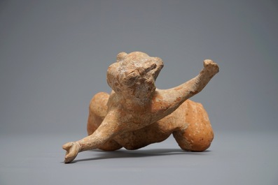 A Chinese pottery figure of a male dancer, Han