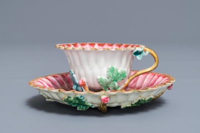 A Chinese famille rose lotus-shaped relief-decorated cup and saucer, Yongzheng