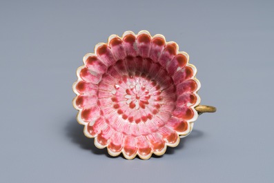 A Chinese famille rose lotus-shaped relief-decorated cup and saucer, Yongzheng