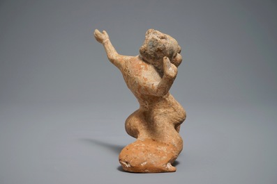 A Chinese pottery figure of a male dancer, Han