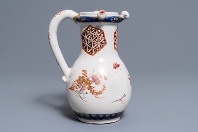 A polychrome petit feu and gilded Dutch Delft puzzle jug with insects and flowers, 1st half 18th C.