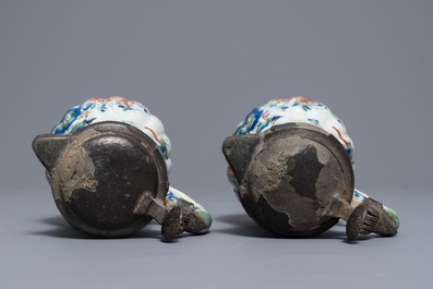 A pair of Dutch Delft cashmere palette jugs with pewter covers, late 17th C.
