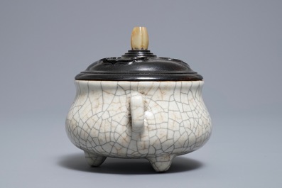 A Chinese ge-type crackle-glazed tripod censer and cover on stand, 19/20th C.