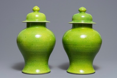 A pair of Chinese yellow and green-glazed vases and covers, 19th C.