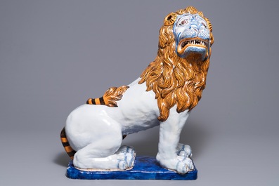 A massive French faience model of a lion, Rouen, late 19th C