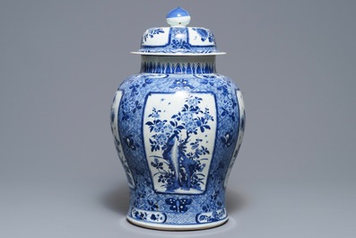 A large Chinese blue and white covered vase with floral design, Kangxi